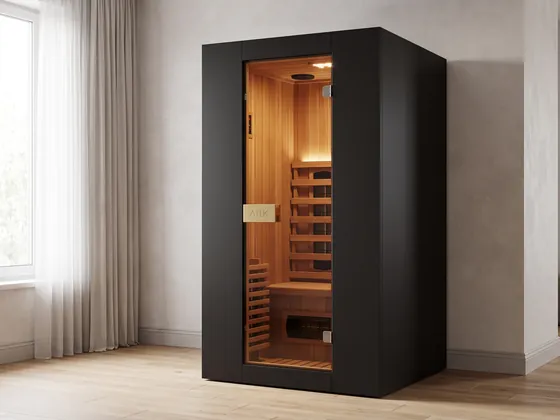 ARK Cedar Small in black: a slim one-person infrared sauna with a cedar interior and a gold ARK plaque